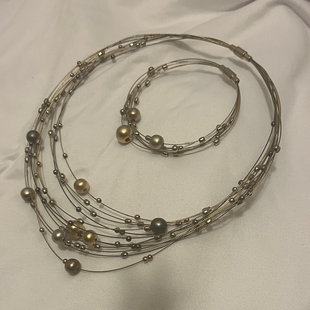 Elegant Multi-Strand Gold and Silver Necklace and Bracelet Set